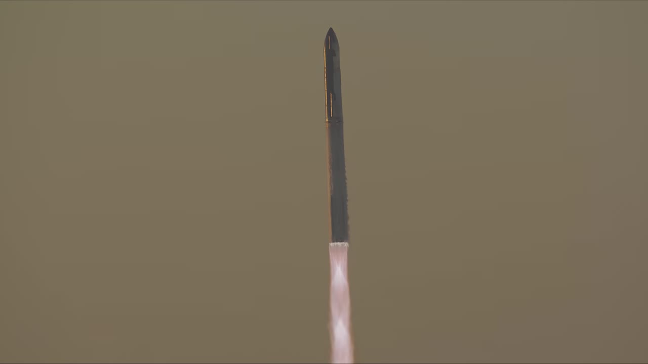 Starship and Super Heavy climbing through a golden sky on Flight 2, November 2023